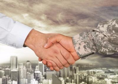 Close up of a man shaking a veterans hand